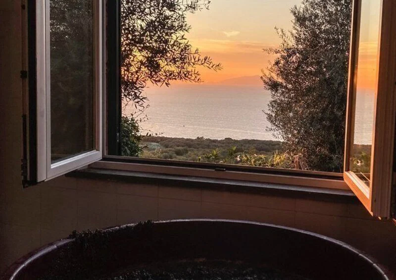 Wine fermenting in the cellar with a view of the Sorrentine coast